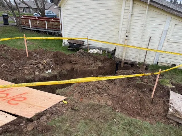 Residential sewer line excavation and replacement by Wild Pine Plumbing in Portland, Oregon